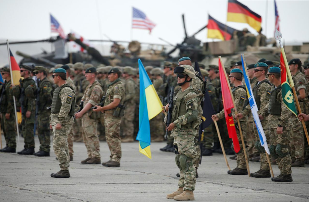 A group of soldiers marching with flags Description automatically generated with medium confidence