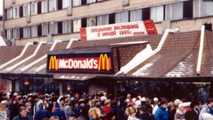 A crowd of people outside a buildingDescription automatically generated with medium confidence