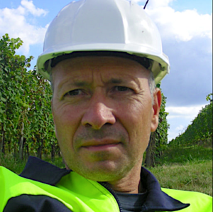 A person wearing a white hard hatDescription automatically generated