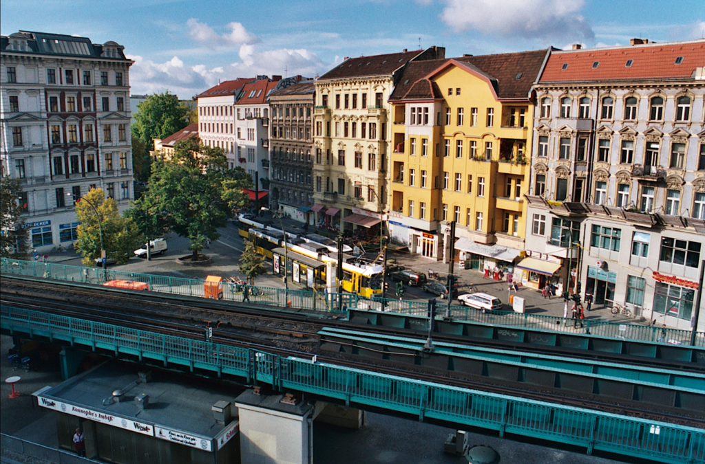 A train tracks in a city Description automatically generated