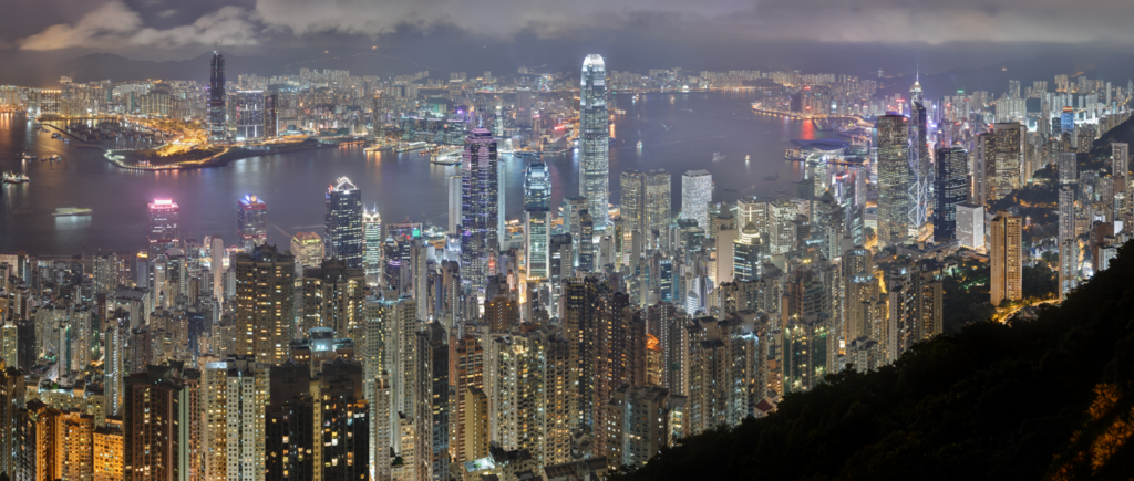 Victoria Peak with lights and water Description automatically generated with medium confidence