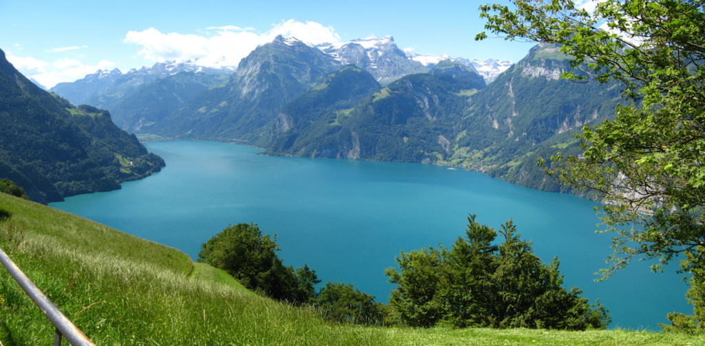 A body of water with mountains in the backgroundDescription automatically generated