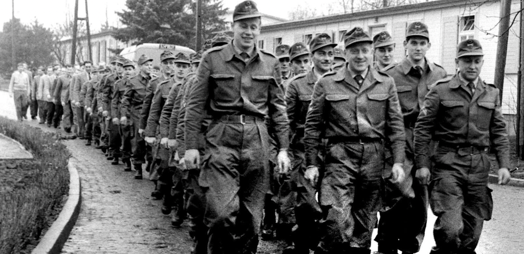 A group of men in military uniformsDescription automatically generated