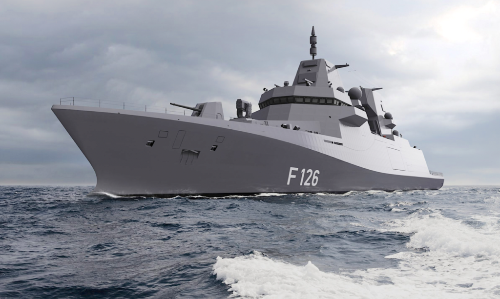 A large military ship in the waterDescription automatically generated