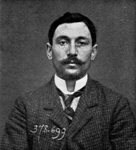 A person with a mustache and a mustache

Description automatically generated
