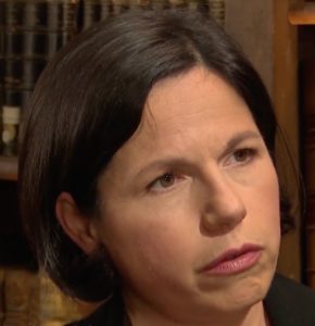 A person with dark hairDescription automatically generated