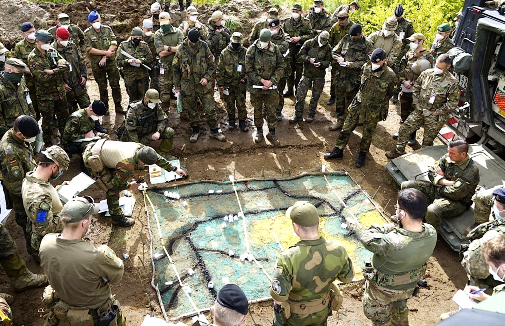 A group of people in military uniformsDescription automatically generated