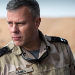 A person in a military uniformDescription automatically generated