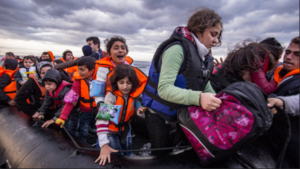 A group of people in life jackets on a boatDescription automatically generated