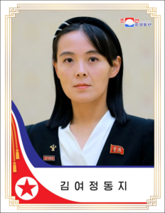 A person with black hair and a white shirtDescription automatically generated