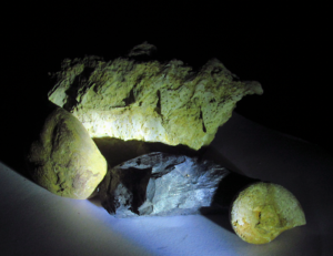 A group of rocks and a rockDescription automatically generated