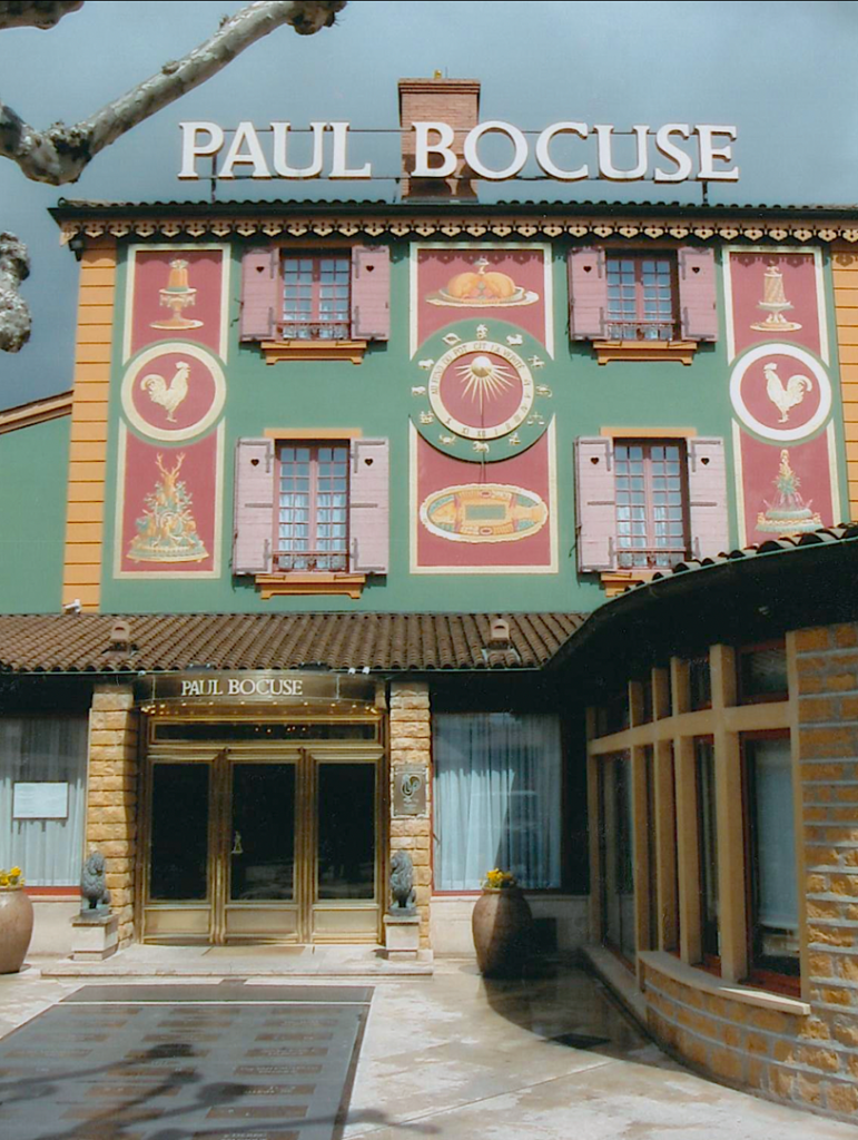 A building with a sign on the side Description automatically generated