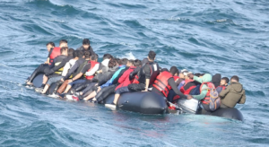 A group of people on a raft in the waterDescription automatically generated