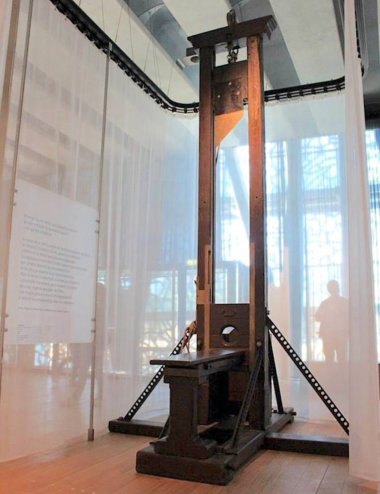A guillotine in a museumDescription automatically generated