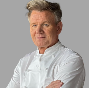 A person in a chef's coat Description automatically generated