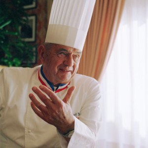 A person wearing a chef's hat Description automatically generated